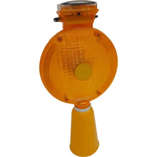 Solar-powered amber light for traffic cones, flashing at night for enhanced road safety and visibility in low light.