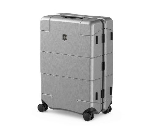 Sleek silver Victorinox Lexicon medium luggage with aluminum frame, TSA locks, and smooth-rolling spinner wheels.