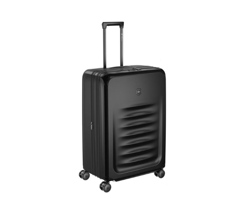 Black Victorinox Spectra 3.0 suitcase, expandable with durable polycarbonate, smooth-rolling wheels, and organized interior.