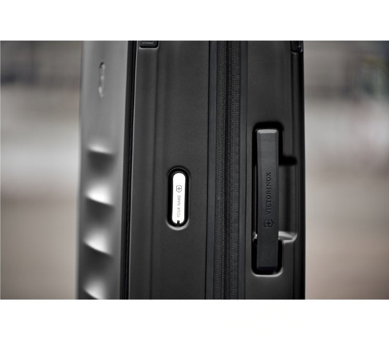 Victorinox Spectra 3.0 Expandable Large Suitcase in black, made from durable recycled polycarbonate with innovative storage features.