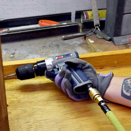 Campbell Hausfeld Air Drill GSD-3/8" with keyless chuck, 30 ft-lbs torque, 2000 RPM, reversible for versatile drilling tasks.