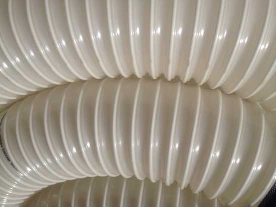 Poly Heavy Antistatic Flexible Ducting, 102 mm, designed for abrasive material transport in industrial settings.