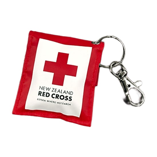 Red Cross CPR Keyring for emergencies, compact shield offers protection against body fluids, fits easily on keychain.