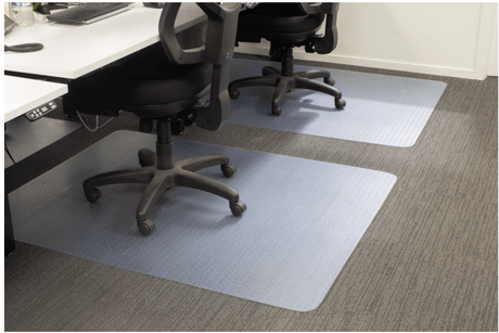 Clear vinyl chair mat measuring 1500 x 1200mm with a leather grain surface, designed to protect floors in offices.