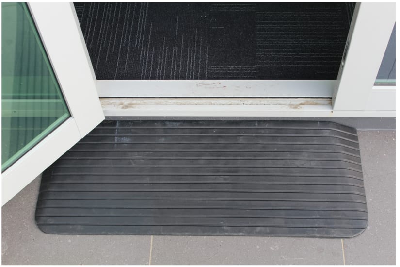 Heavy-duty black rubber access ramp measuring 1100 x 420 x 50mm, designed for wheelchair and trolley mobility with non-slip ribbed surface.