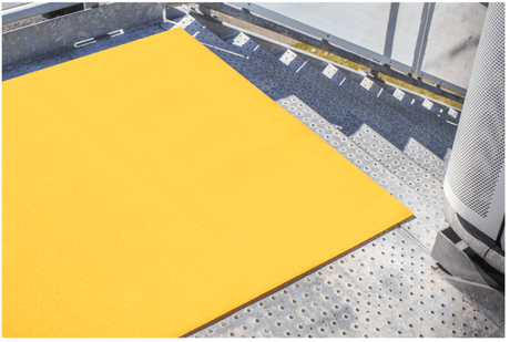 Bright yellow fibreglass floor grit panel, 1200 x 600mm, offering non-slip surface for safety in high-traffic areas.