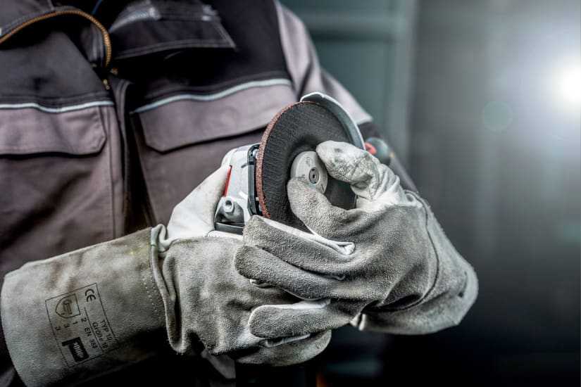 Metabo 1700W angle grinder featuring ergonomic design, quick disc change, and advanced safety features for optimal control.