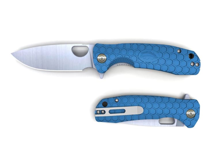 Honey Badger Flipper Knife in blue, featuring a stainless steel blade, non-slip grip, and ball bearing mechanism for smooth operation.