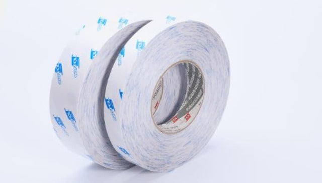 Double-sided white Orafol tape on a 5000 roll, ideal for various surfaces with high adhesion strength and UV resistance.