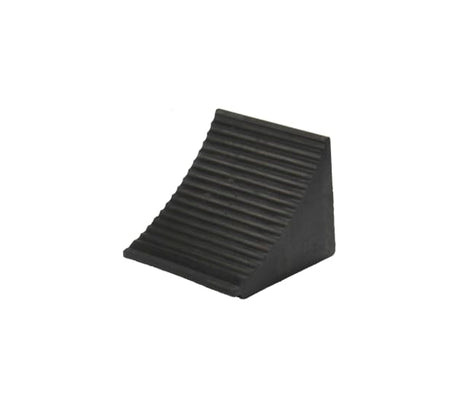 Large wheel chock made of durable thermoplastic rubber, featuring a ribbed slope and grab handle for secure vehicle stability.