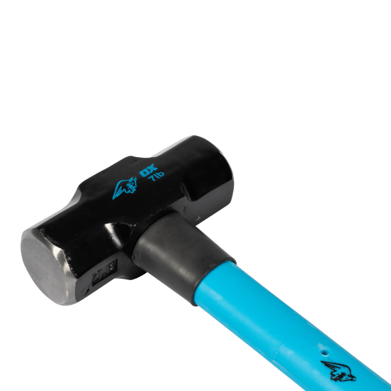 Heavy-duty OX Trade sledge hammer with 3.2kg fibreglass handle, rubber grip, and durable tempered steel head for demolition tasks.