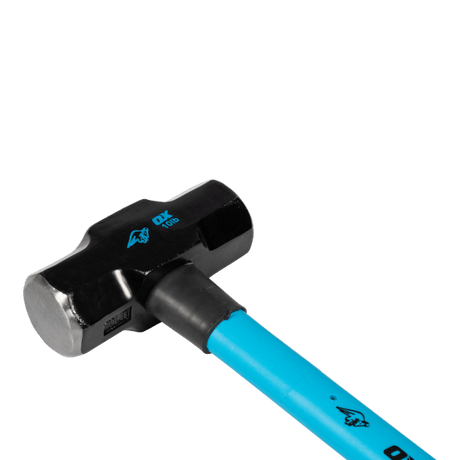 Heavy-duty OX Trade sledge hammer with 4.5kg fibreglass handle, steel head for durability, and shock-absorbing grip for control.