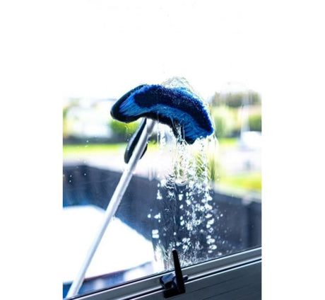 1.6M Extendable Wash Brush featuring a soft bristle head, adjustable handle, and quick-connect hose for versatile cleaning.