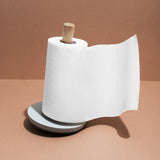 Elegant oak wood paper towel holder with non-slip base for easy access and stylish kitchen organization.