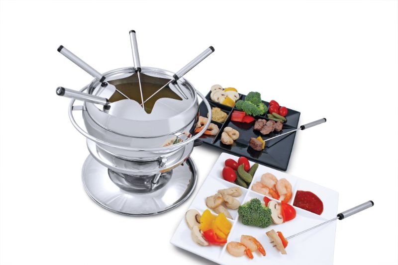 Swissmar Zuri 11-piece stainless steel fondue set with ceramic insert for cheese, meat, and chocolate, perfect for gatherings.