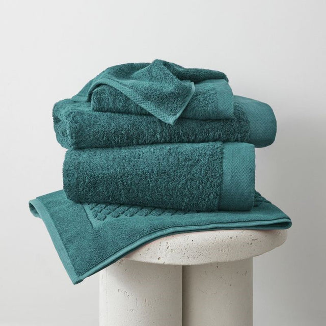 Teal bamboo bath mat (51x76cm) with natural anti-bacterial properties and eco-friendly, soft, absorbent design.