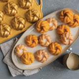 Elegant braided design mini bundt pan for perfect individual cakes, crafted from durable cast aluminum for even baking.