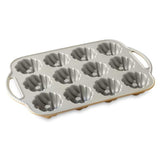 Elegant Nordic Ware mini bundt pan with braided design, perfect for individual desserts and even baking.