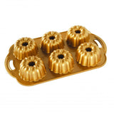 Mini Bundt pan for six individual cakes, crafted from durable cast aluminum with intricate design for striking baked treats.