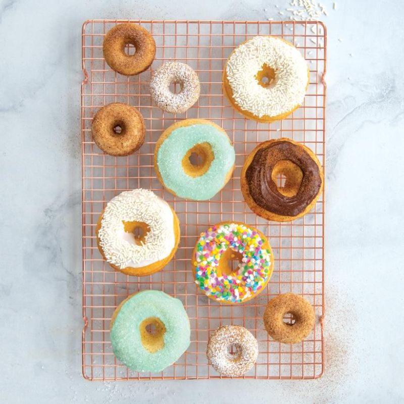 Nordic Ware Classic Full Donut Pan in vibrant colors for 6 healthy, baked donuts; nonstick, durable design for perfect results.