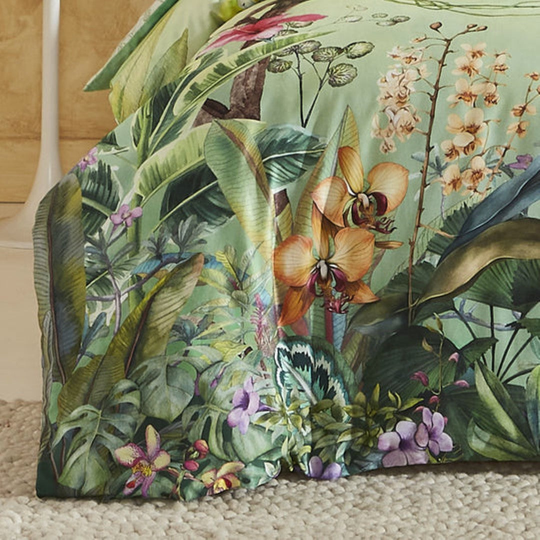 Super King duvet cover set in green featuring vibrant hibiscus and orchids design on breathable cotton sateen fabric.