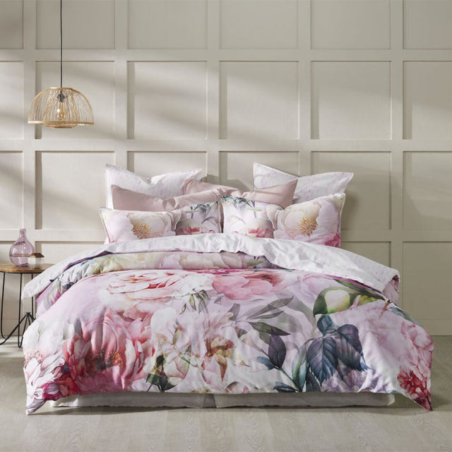 Super King Duvet Cover Set in soft pink florals with a geo print reverse, crafted from luxurious 100% cotton sateen.