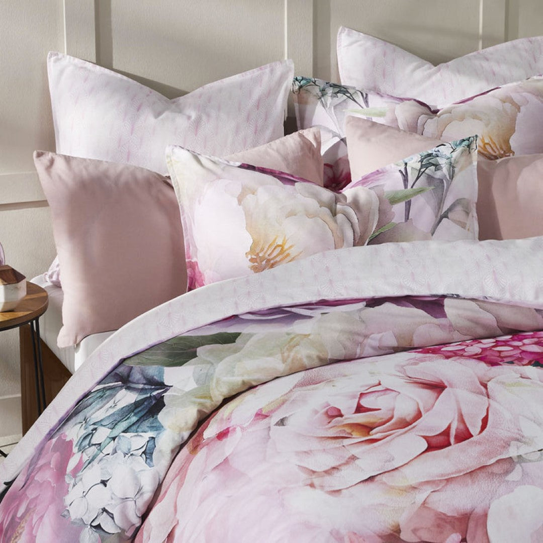 Super King Duvet Cover Set in soft pink florals with a geo print reverse, crafted from luxurious 100% cotton sateen.