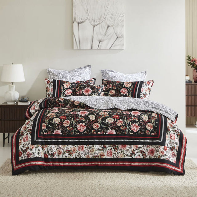 Super King Duvet Cover Set in black featuring a floral design with cherry blossoms and a grey geo/floral reverse.