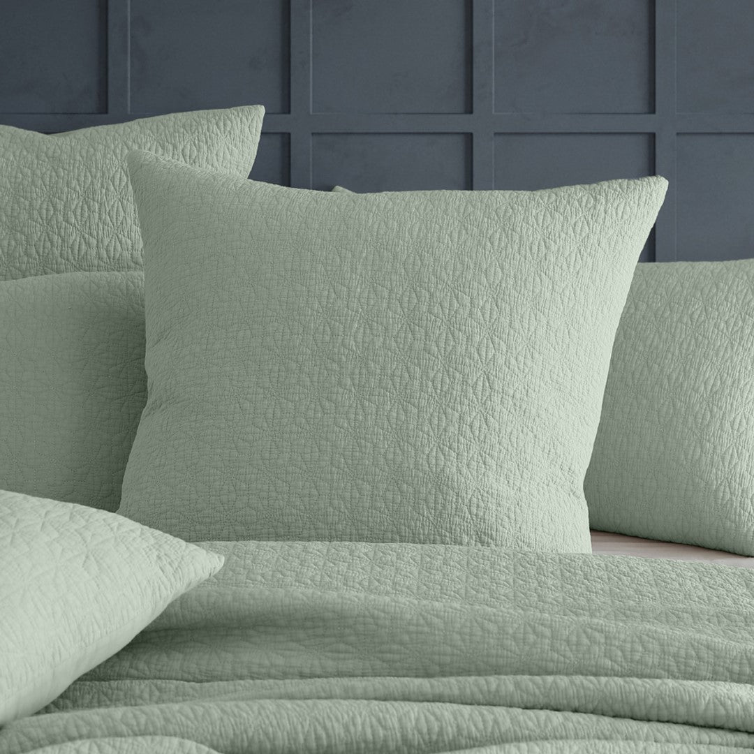 Elegant sage European sham featuring modern geometric embroidery on soft 100% cotton, perfect for refined bedroom decor.