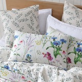 Super King Duvet Cover Set featuring vibrant floral design on ivory, crafted from 100% cotton sateen for luxurious comfort.