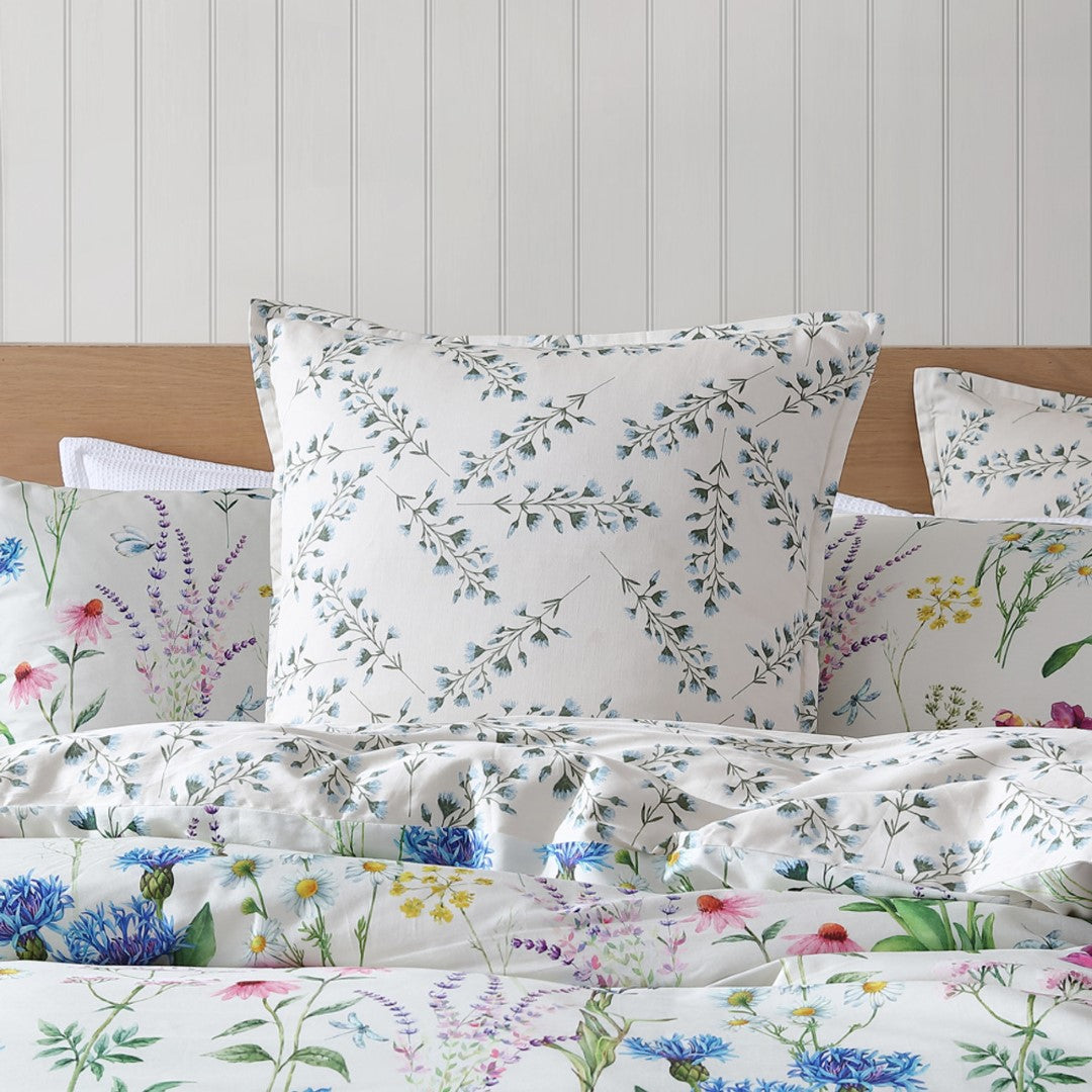 Elegant Logan and Mason Floriana Ivory king duvet cover set featuring floral design, soft fabric, and matching pillowcases.