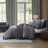 Queen duvet cover set in charcoal with herringbone pattern; 100% cotton for softness and elegance, includes quilt and pillowcases.