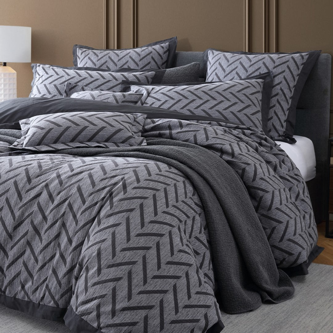 Queen duvet cover set in charcoal featuring a modern herringbone pattern, crafted from 100% cotton for comfort and elegance.