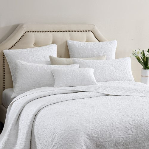 Elegant Aerin Ivory Bedspread featuring modern damask design, 100% cotton, and textured quilting for a stylish bedroom upgrade.