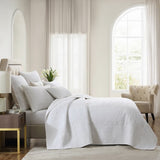 Aerin Ivory Bedspread featuring modern damask, 100% pre-washed cotton, intricate quilting, and a self-bound edge for elegance.