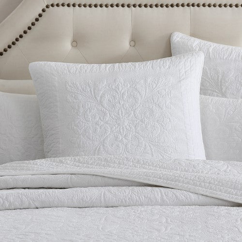 Luxurious ivory Eurosham with quilted design, 100% cotton, self-bound edge, enhancing modern bedroom decor.