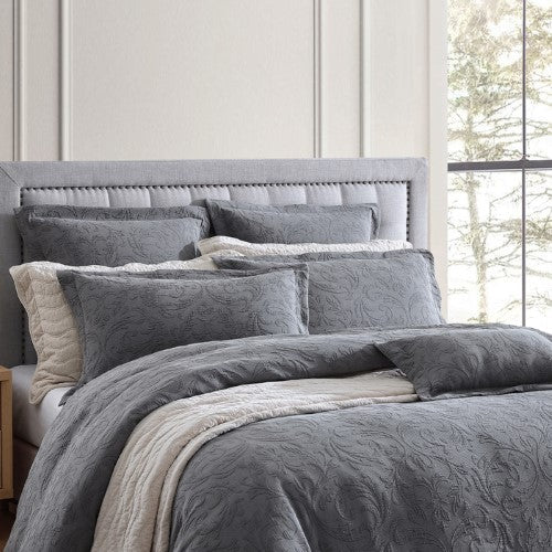 Queen duvet cover set in charcoal with modern damask design, featuring soft matelassé texture and tailored self-flange edges.