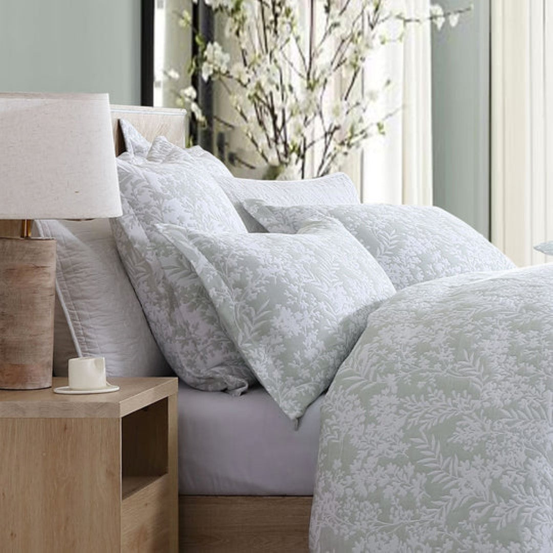 Super King Duvet Cover Set in Quinn Sage features elegant Australian foliage designs on a white backdrop, complete with pillowcases.