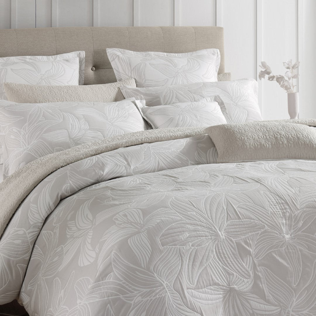 King duvet cover set featuring stylized hibiscus flowers in a soft color palette, crafted from premium cotton-polyester blend.