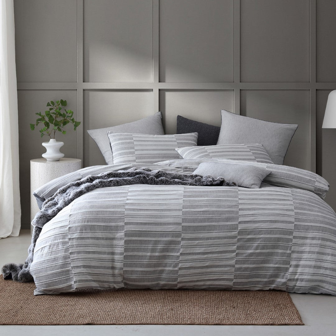 Queen duvet cover set in Platinum Balmoral Ash with textured check pattern, piped edges, and two matching pillowcases.