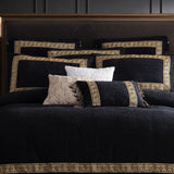 Luxury black cushion with gold-embroidered Greek key design, tassels, and corded piping; perfect for enhancing home decor.