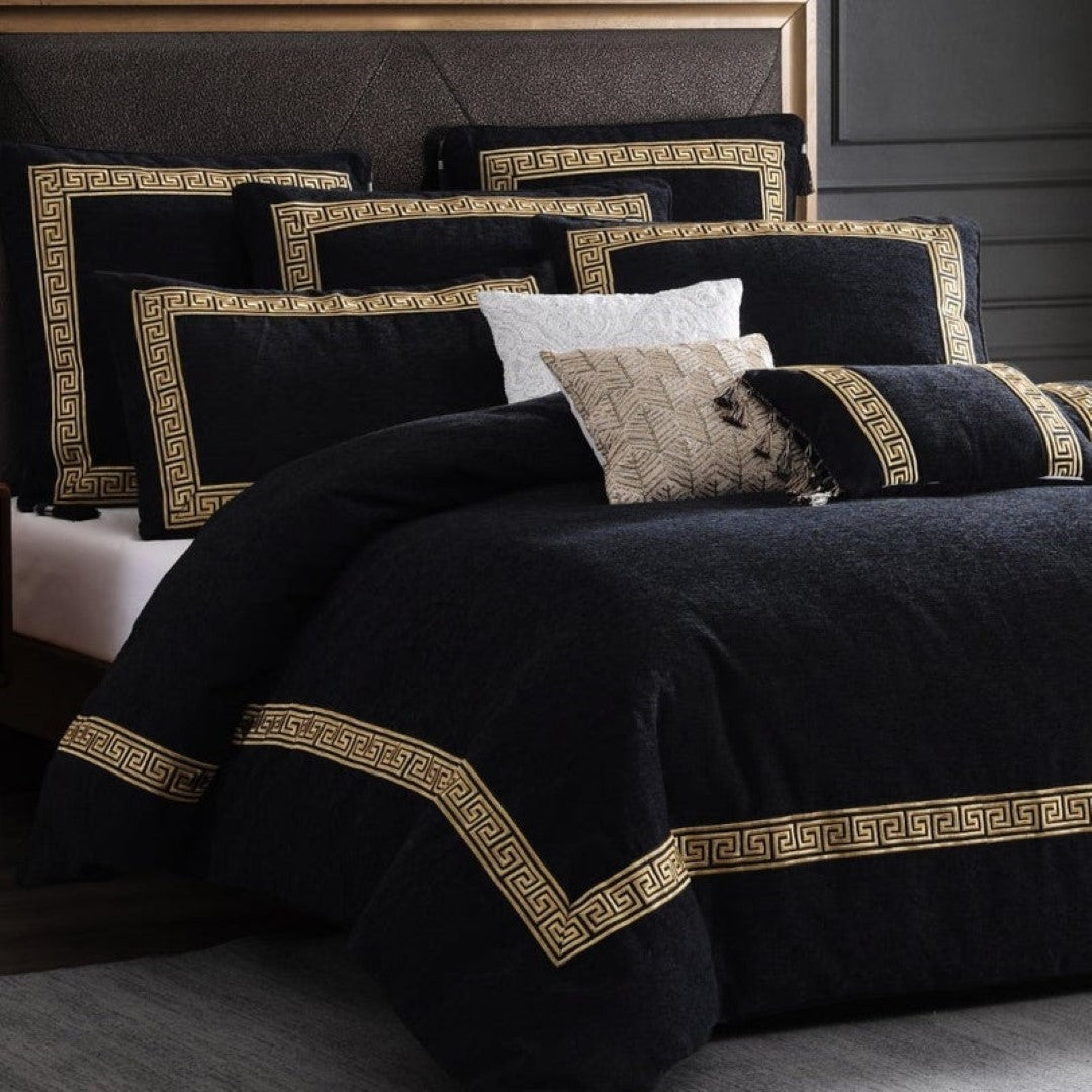 Olympia Black cushion featuring Greek key design with gold embroidery and tassels, adds luxury to any decor.