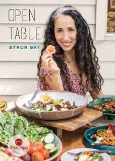 Cookbook "Open Table" showcasing diverse global recipes, by Ronit Robbaz, celebrating healthy, seasonal ingredients.