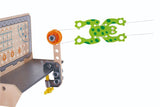 Hape Three Experiment Kit featuring a mechanical grabber, crane, and climbing frog for young inventors aged 4 and up.