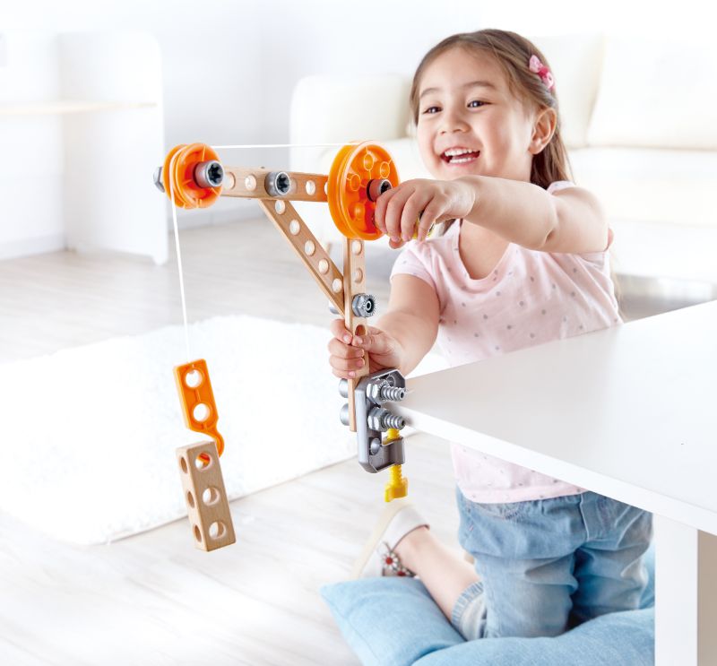 Hape Three Experiment Kit featuring a mechanical grabber, crane, and climbing frog for ages 4 and up.