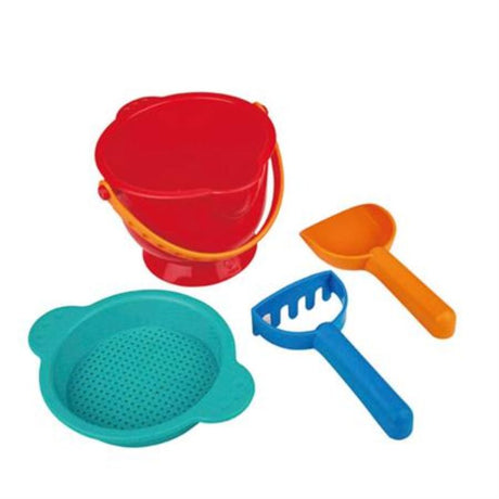 Colorful Hape Beach Basics set featuring a pail, shovel, rake, and strainer for toddlers' beach play and creativity.