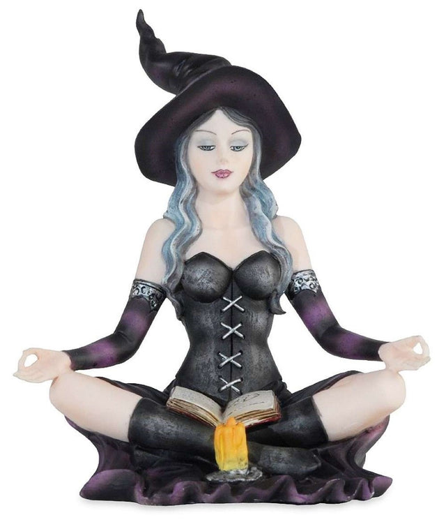 Purple witch ornament sitting and reading, perfect for Halloween decor, vibrant color, 8 x 11 x 12.5 cm resin design.