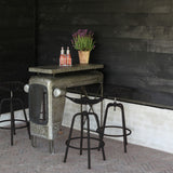 Vintage black tractor bar stool with adjustable height, comfortable seating, and a footrest, measuring 50 x 48 x 70cm.