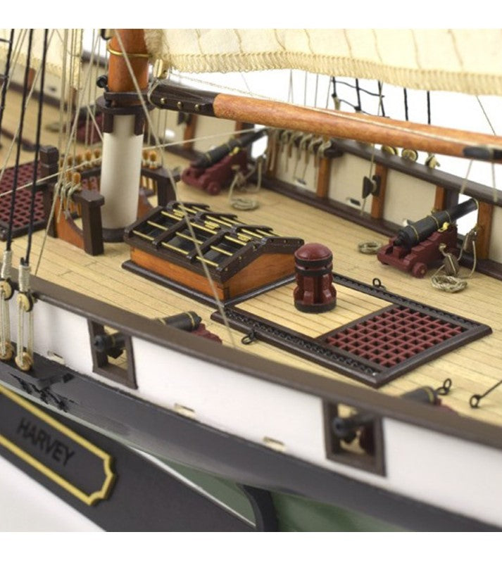 Detailed 1:60 scale wooden model of the American schooner Harvey with eight cannons and exquisite craftsmanship.