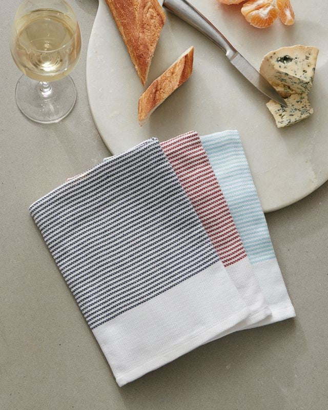 Absorbent lint-free tea towels in Midnight, Fire, and Water colors, made from 100% OEKO-TEX® Certified cotton.